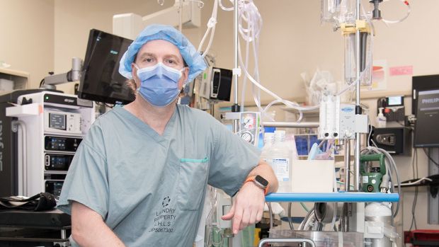 Dr. Anton Skaro with the pump that helps circulate blood to organs that are to be donated.