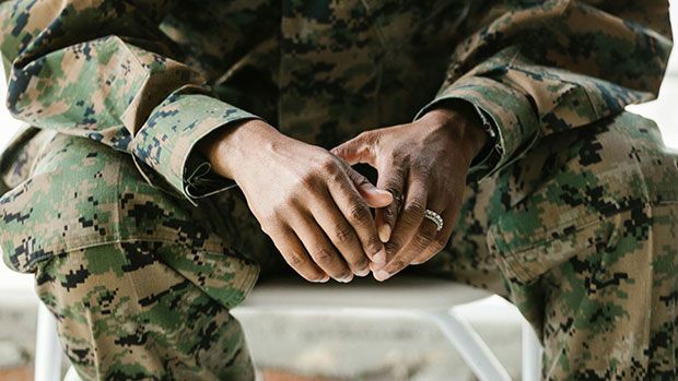 Hands of woman in military uniform