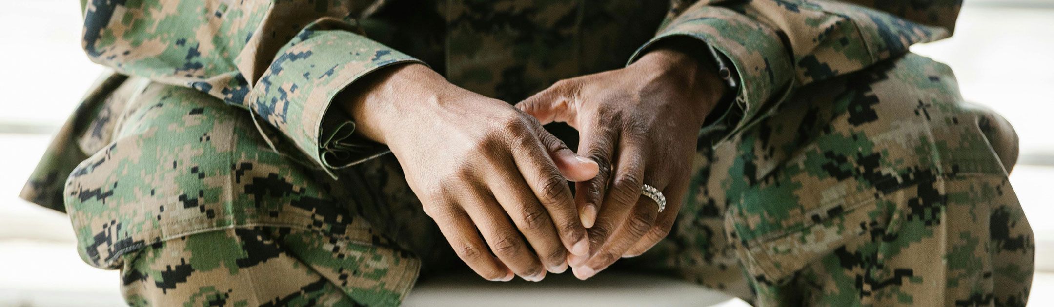 Hands of woman in military uniform